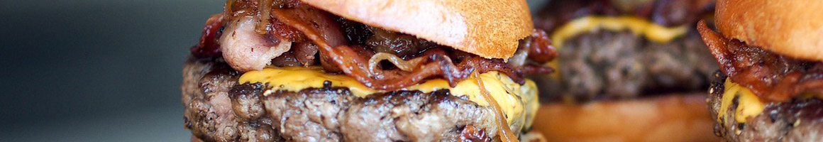 Eating Burger at Paul's Da Burger Joint restaurant in New York, NY.